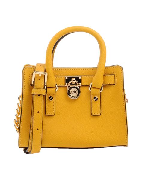 michael kors bright yellow bag|Michael Kors yellow shoulder bag.